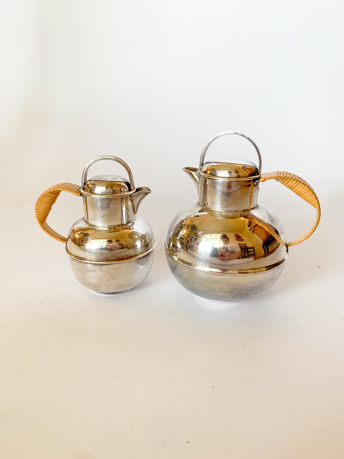 1930s Silver Plate and rattan creamer pitchers