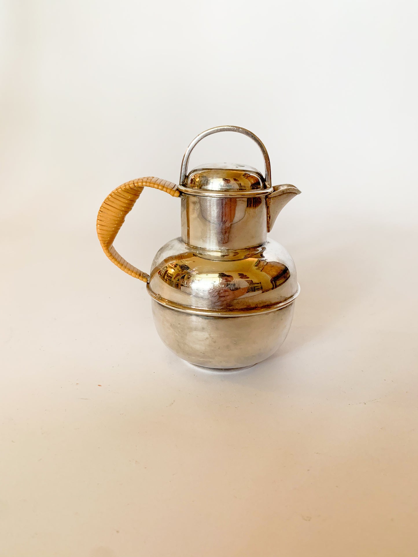 1930s Silver Plate and rattan creamer pitchers