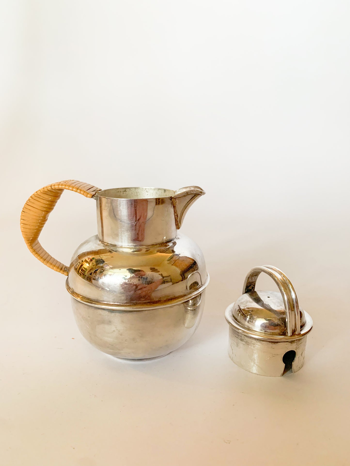 1930s Silver Plate and rattan creamer pitchers